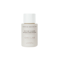 A bottle of ORI Lab by NAK Hair Restore Cleanse with a white cap and label, 100ml size.