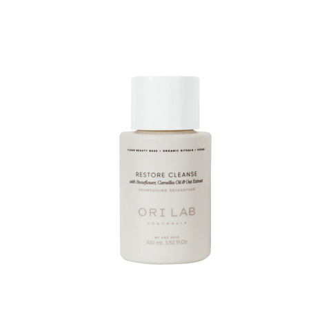 A bottle of ORI Lab by NAK Hair Restore Cleanse with a white cap and label, 100ml size.