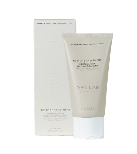 A hair restore treatment product by ORI Lab, in a beige tube with a white and gold packaging, indicating it rehydrates and restores moisture to dry and dehydrated hair.
